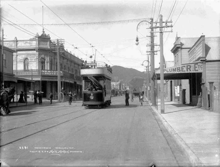Riddiford Street, 1904, with a brand new electric tram at a stop. The recently completed Newtown Hotel (1902, later the Ascot Theatre) is in the distance. Image: National Library reference 
