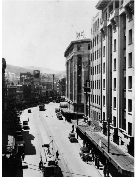 Circa 1930 photograph of Lambton Quay showing DIC and the nearby T & G building – also designed by A & K Henderson.  Lambton Quay, Wellington. Ref: 1/2-C-03564-F. Alexander Turnbull Library, Wellington, New Zealand. http://natlib.govt.nz/records/22551153